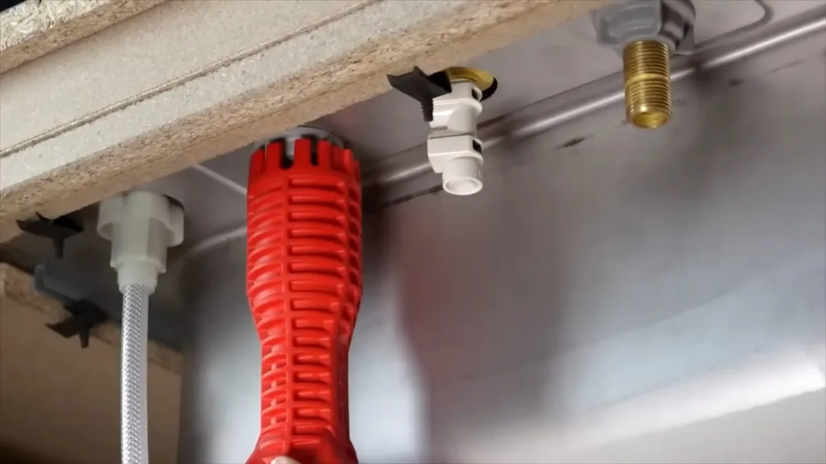 Plumber repairing a pipe that burst after freezing overnight