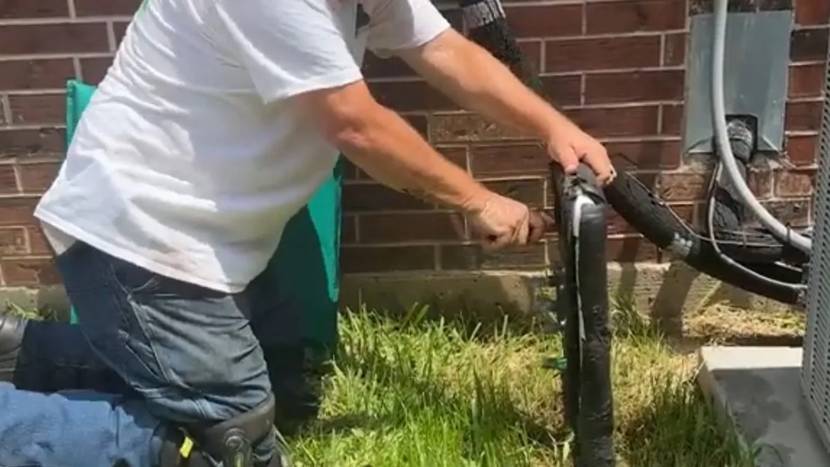 Plumber repairing a valve assembly on a home's water supply line